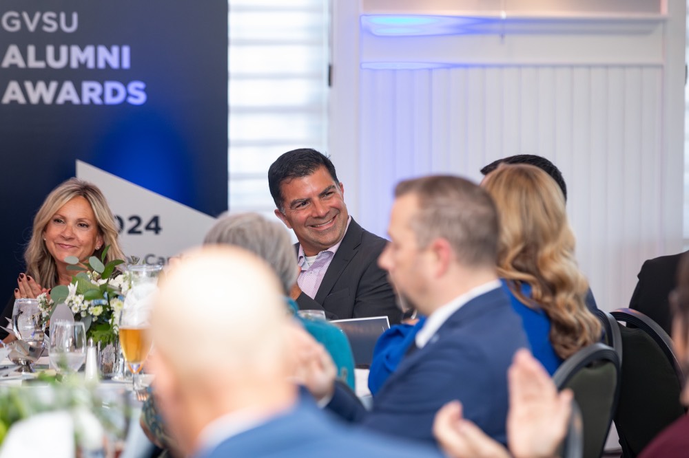 Man smiling at people